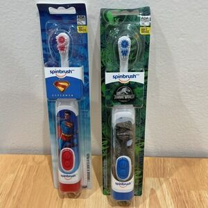 2x Bundle Spinbrush Superman & Jurassic Park Battery Powered Soft Toothbrush NEW